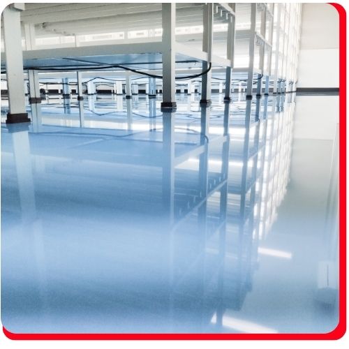 Glossy light blue epoxy floor in a clean industrial facility in Barrie.
