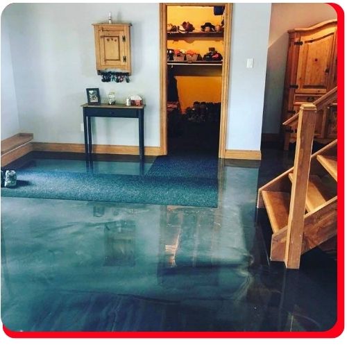 Reflective black metallic epoxy flooring in a cozy residential Cambridge home.