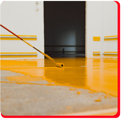 Applying a bright yellow epoxy floor coating in a clean commercial space in Mississauga.