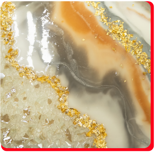 Close-up of a luxury geode-inspired metallic epoxy floor with gold leaf accents in Muskoka.