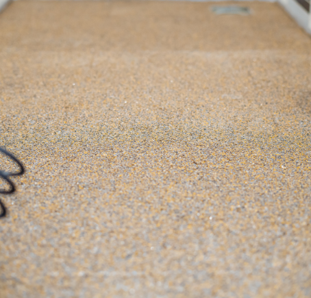 Textured quartz epoxy flooring applied in a Richmond Hill commercial or residential space.