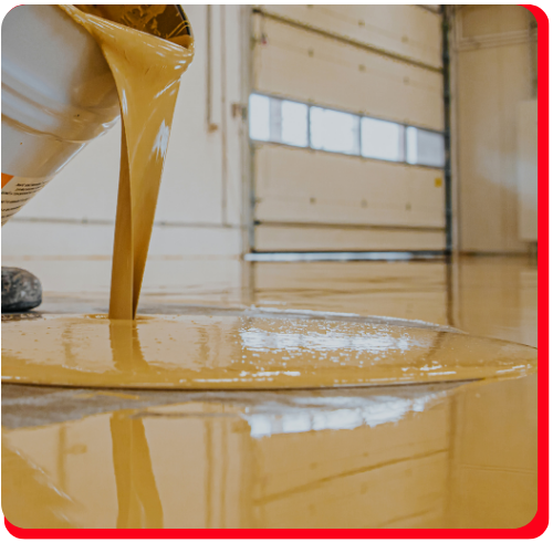 Golden self-leveling epoxy being poured on a commercial floor in Richmond Hill.