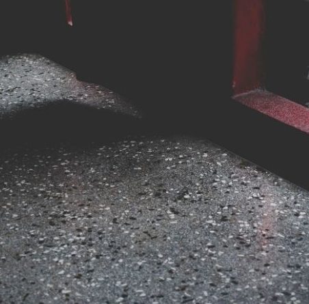 Close-up of speckled epoxy flake flooring in a Toronto garage or workshop.