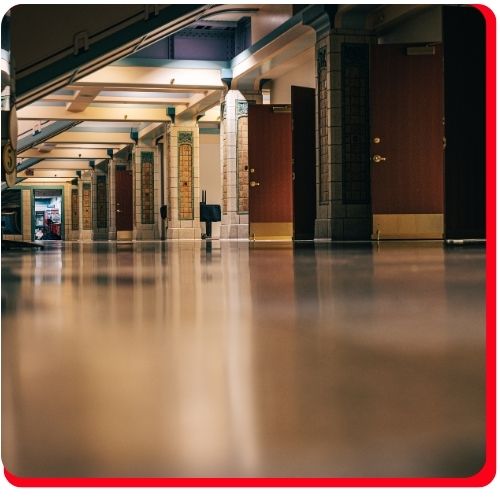 Polished commercial epoxy flooring in a Toronto building hallway.