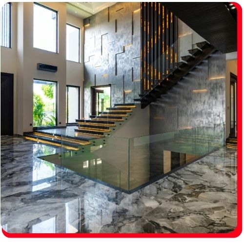 Luxurious marble-style epoxy flooring in a modern Toronto home with floating staircase.