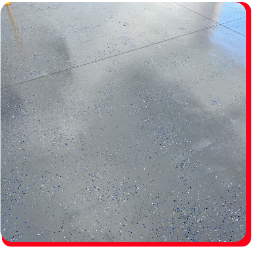 Close-up of decorative flake epoxy flooring in a Vaughan garage.