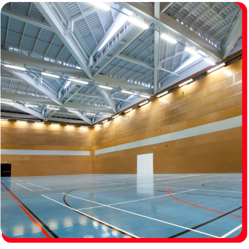 Glossy epoxy sports flooring in a modern Vaughan gymnasium.