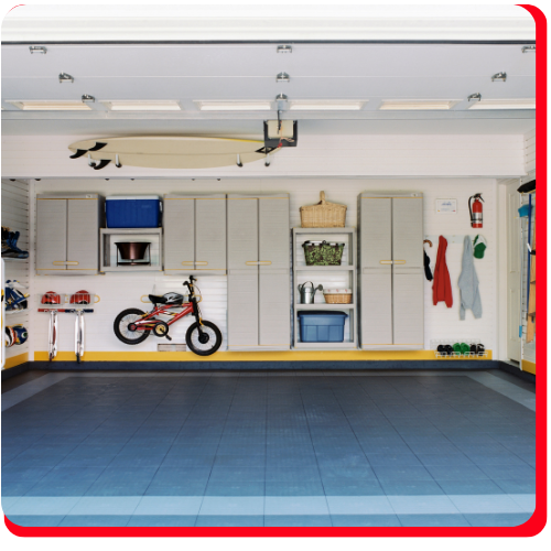 Well-organized residential garage with custom epoxy flooring and built-in wall storage.