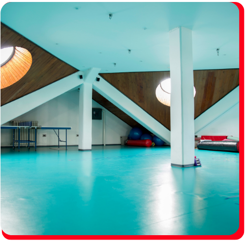 Bright blue waterproof floor coating installed in a Hamilton fitness or recreational space.