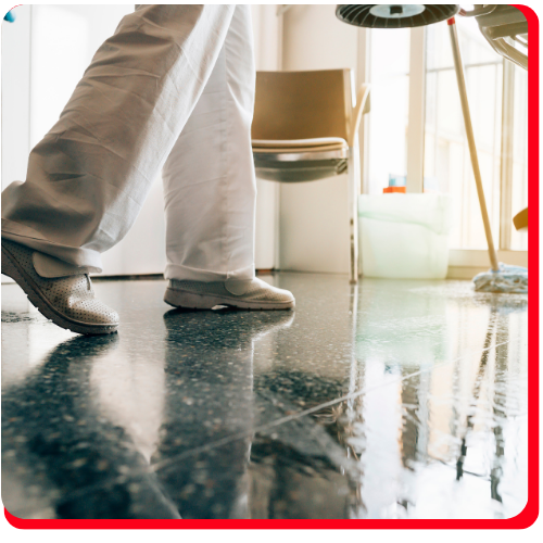 Close-up of a healthcare professional walking on a reflective, waterproof epoxy-coated floor in a medical facility in Hamilton.